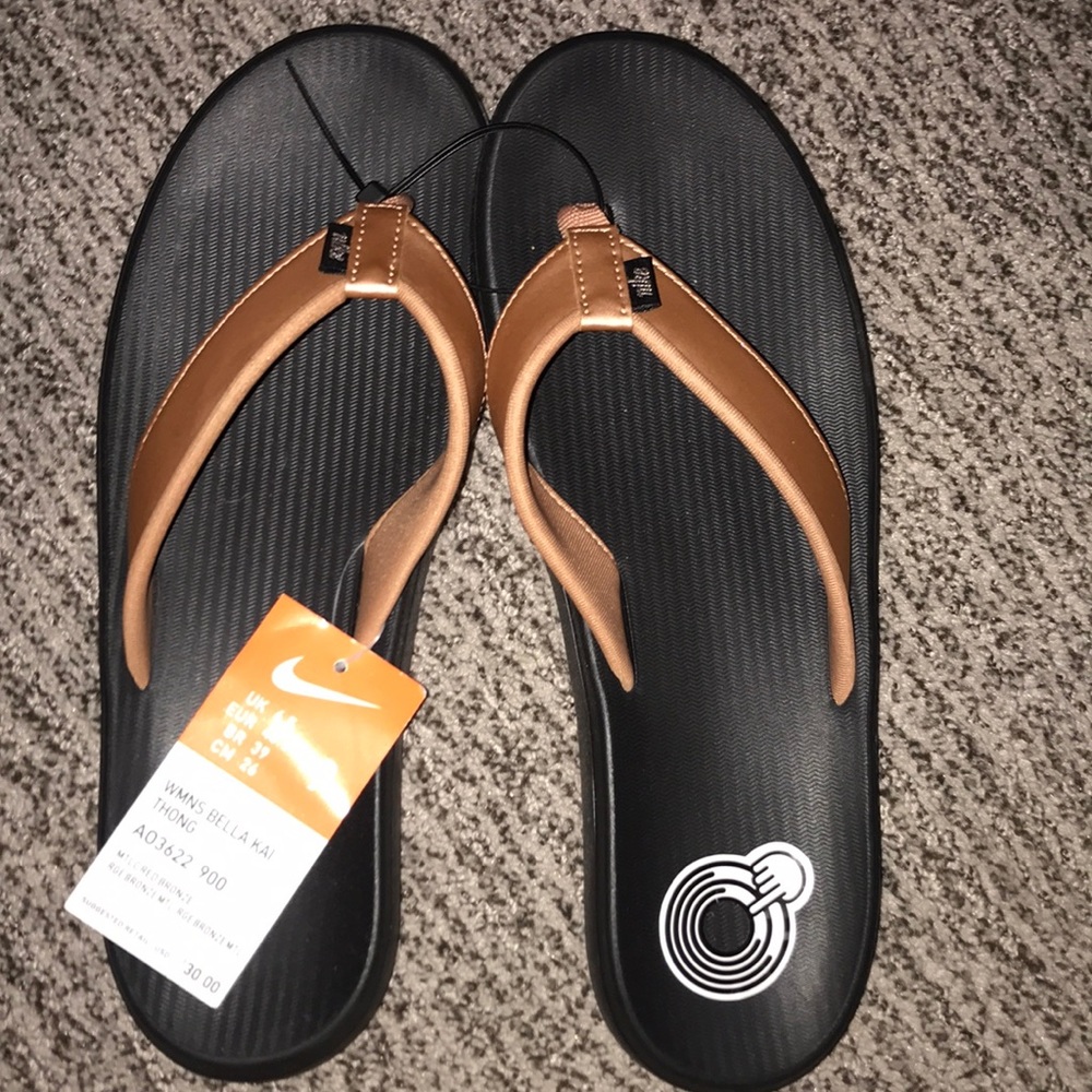 Rose gold Nike flip flops